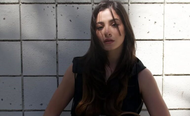 Confidently rocking the new Prada Re Nylon bag in style with Yusra Mardini.