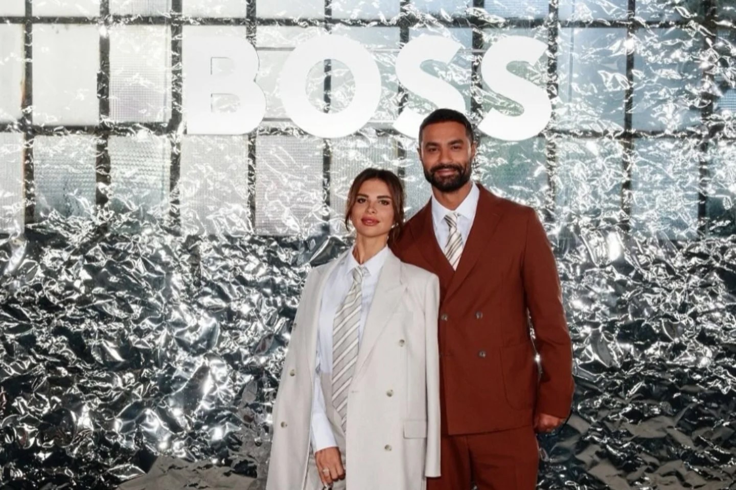 @karimfahmiofficial and @daniaelbanawy serving sleek sophistication at #MFW, looking sharp as ever in @boss.